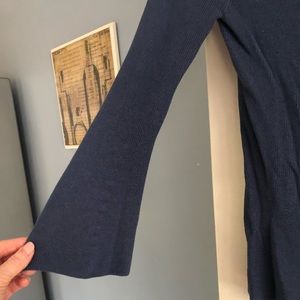 Navy blue sweater with bottom and belled sleeved